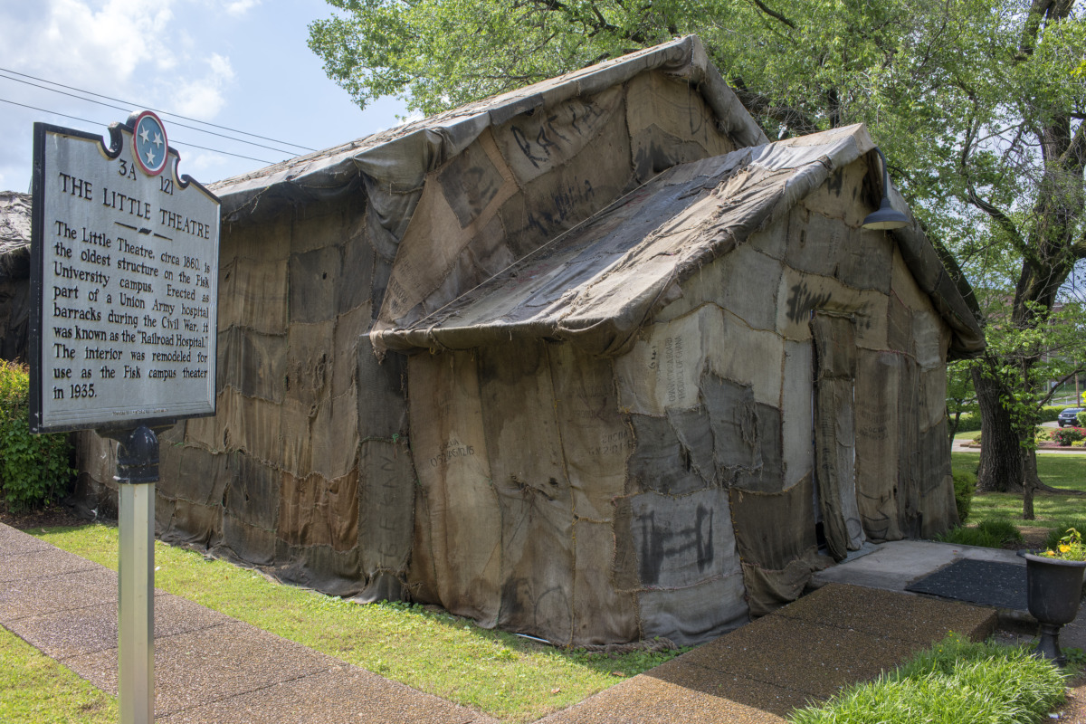 a small building covered in burlap sacks.