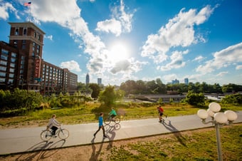 aerial view of the Atlanta Beltline where people are seen biking and walking on a sunny day