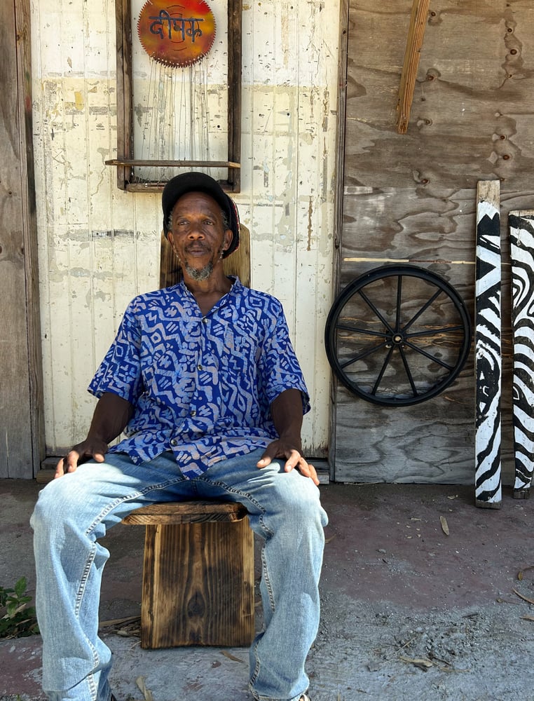 The artist Mazola Wa Mwashighadi in front of his studio, Found Objects, in Jamaica. 