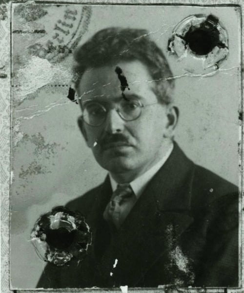 old distorted portrait of Waler Benjamin - white man with glasses and mustache in a suit