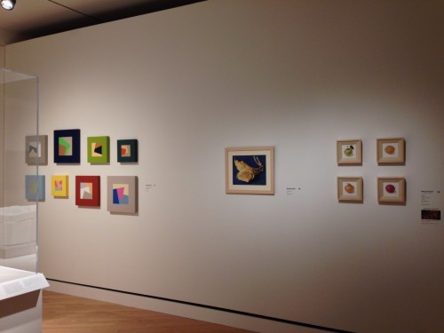 Mary Ann Currier, (left group) Ruminations on the Right Angle" series, acrylic on panel, and (right group) colored pencil drawings of vegetables. 