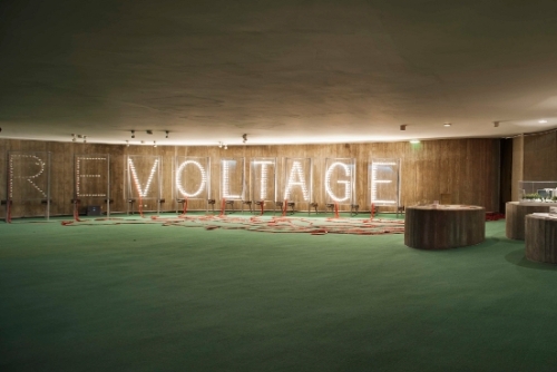 Raqs Media Collective's exhibition "Reading Light" was presented in Oscar Niemeyer's iconic Paris building built for the French Communist Party at Place Colonel Fabien. The collective created a set of illuminated signs, typography, and electricity, urging a re-spark of human aspirations. 