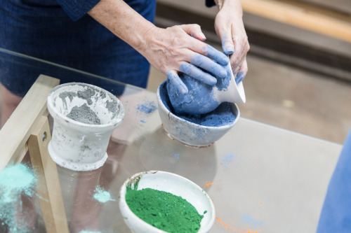 Carr adding color to one of her vessels.