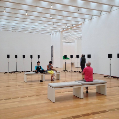 Janet Cardiff's The Forty Part Motet at the High. The installation, notes Kooi, "simultaneously enabl[es] and den[ies] a transcendental experience."