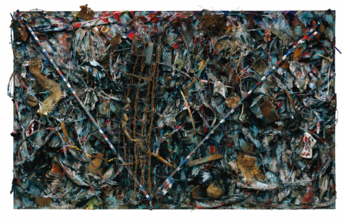 Thornton Dial, Victory in Iraq, 2004; Mannequin head, barbed wire, steel, metal grating, clothing, tin, electrical wire, wheels, stuffed animals, toy cars and figures, plastic spoon, wood, basket, oil enamel, spray paint, and Splash Zone compound on canvas on wood, 83½ by 135 16½ inches.