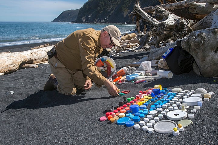 Mark Dion sorts plastic found on the beach at Gore Point as part of the Gyre expedition in Alaska, June 2013. (Photo: Kip Evans)