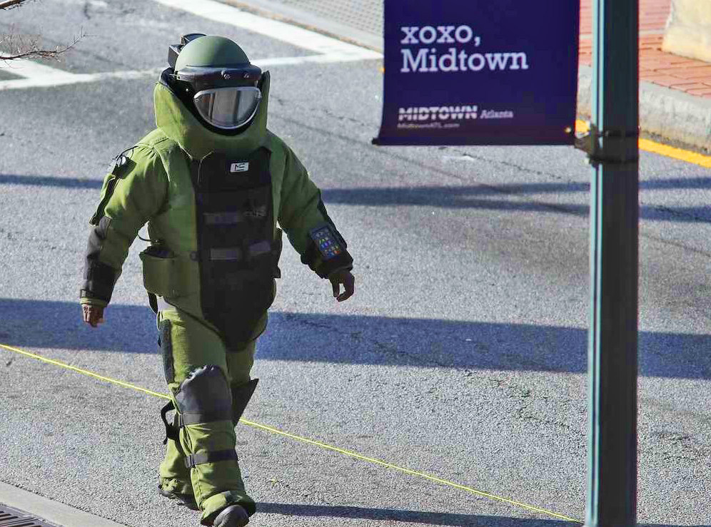 A member of the Atlanta Bomb Squad walks towards the "suspicious object" on the 14th Street Bridge. 