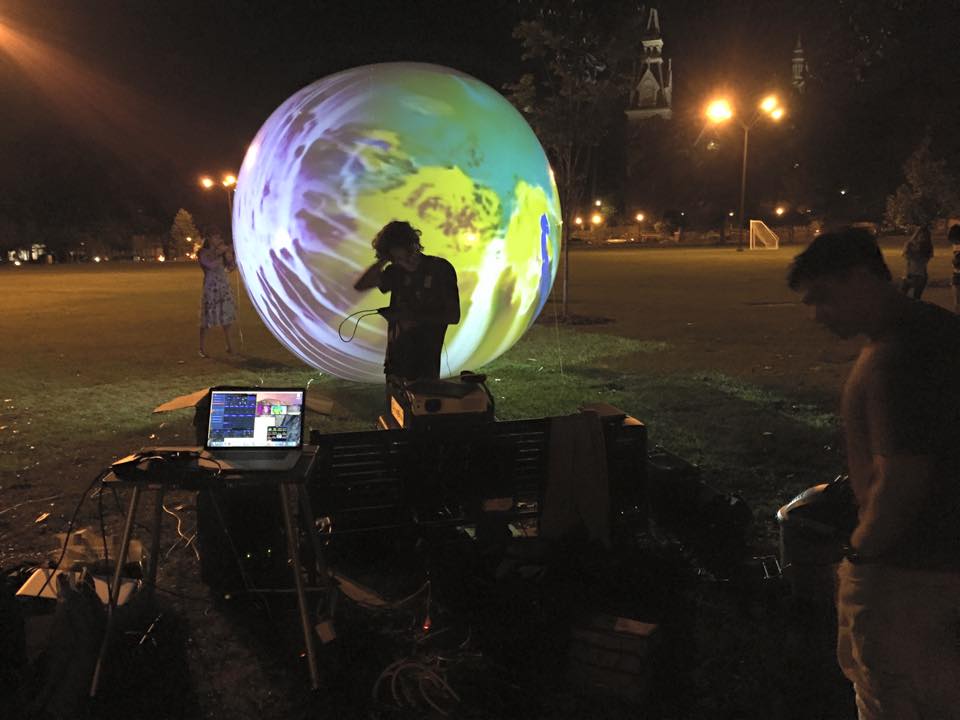 Mercer students working on their XVAC project, Sweet Dreams of Spring, which was projected in Macon's Tattnall Square Park this past April. 