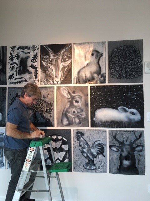 Joe Peragine creating an installation of drawings at 1065 Midtown. 