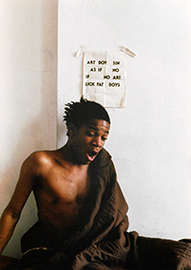 Jean-Michel Basquiat in a sleeping bag on the floor, from the film Boom for Real.