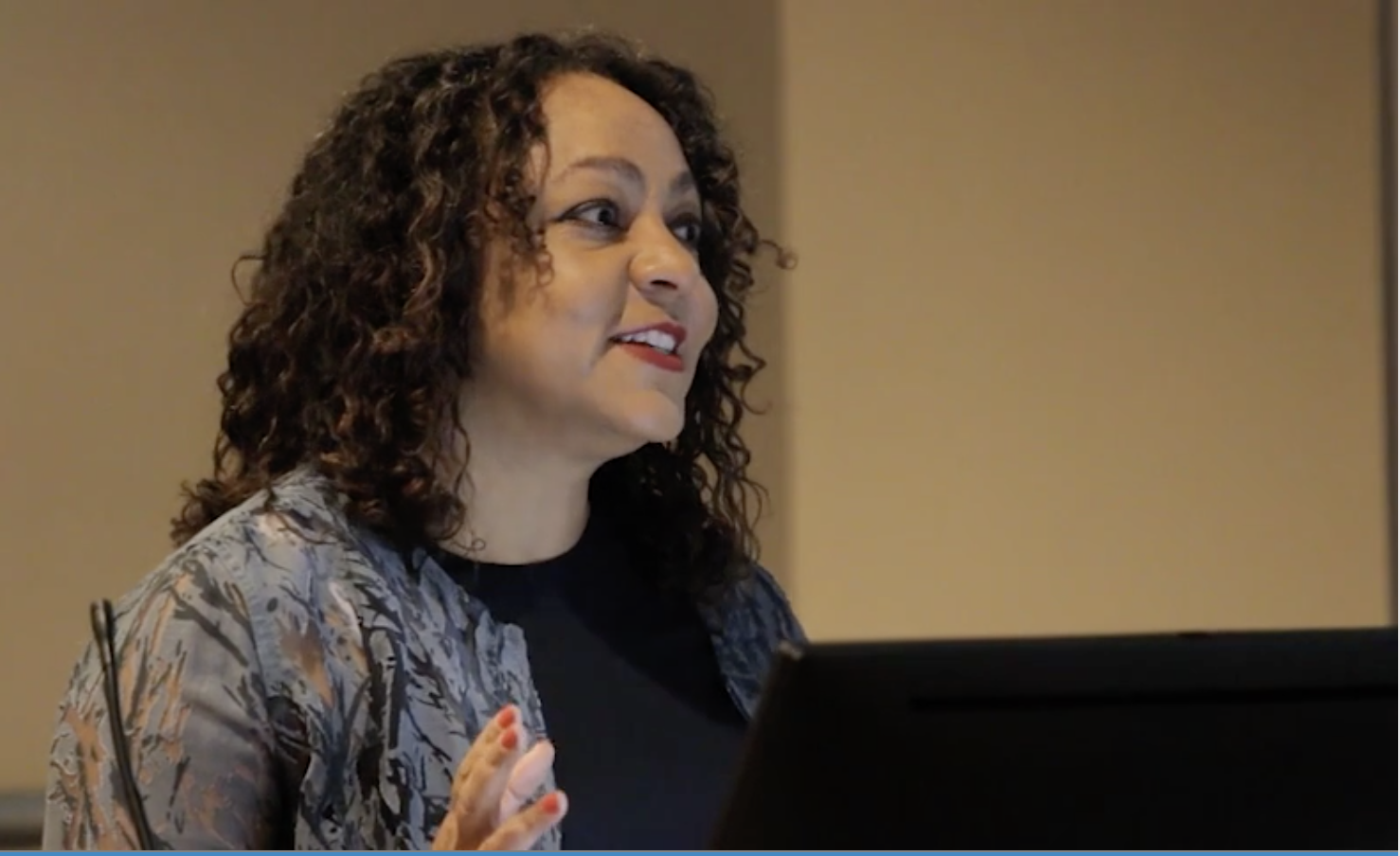 Kirsten Pai Buick giving a talk at Georgia State University.