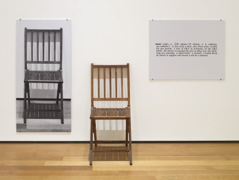 Artwork by Joesph Kosuth, photo of a chair on the wall, the actual chair sitting next to it, and a panel of text.