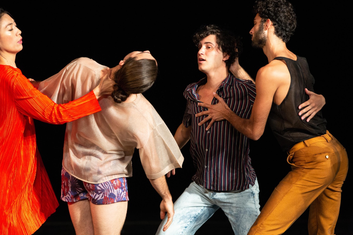 Four performers in street clothes interacting, from Tere O'Connor Dance.