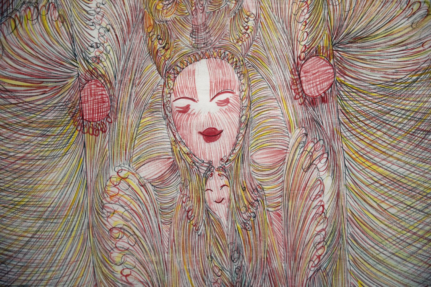 a smiling figure in pink, yellow, and green lines.