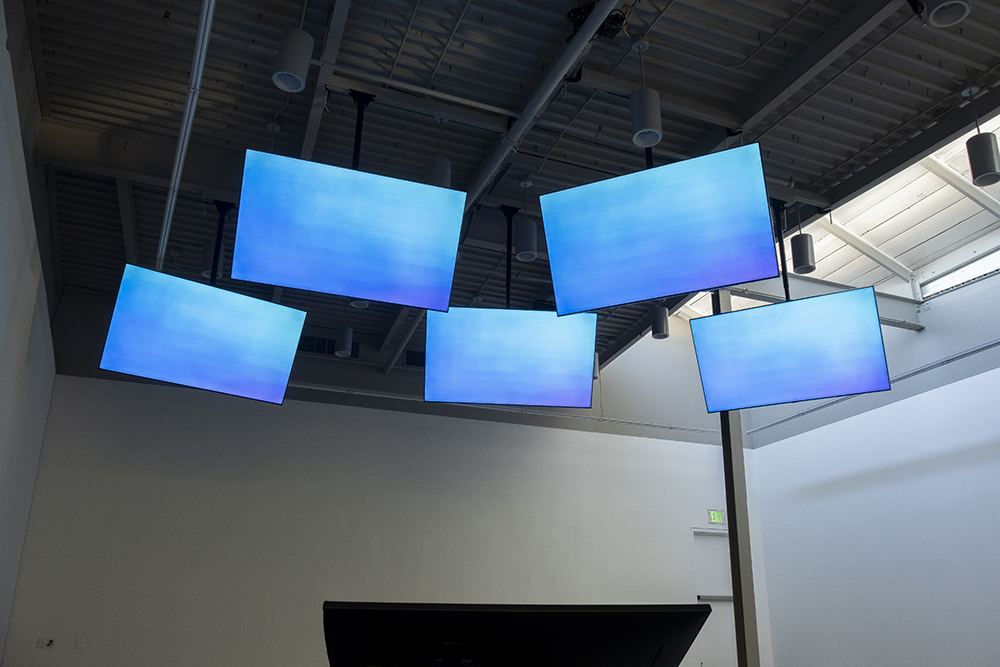 five screens showing blue sky