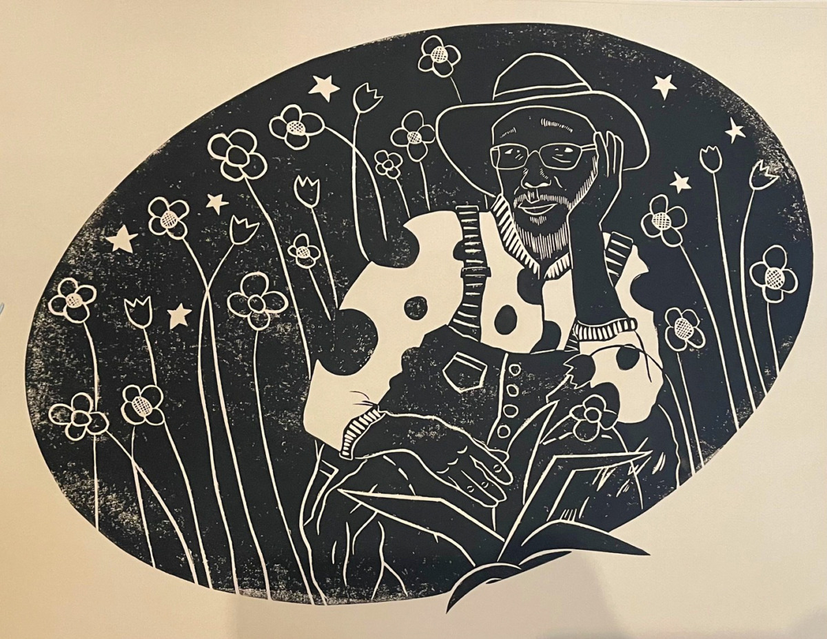 a wood cut print of a man in overalls relaxing in flowers