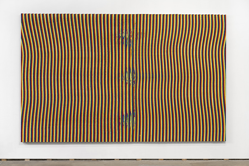 a large canvas on a white wall, on the canvas are yellow, red, and blue vertical lines, resembling electromagnetic waves 