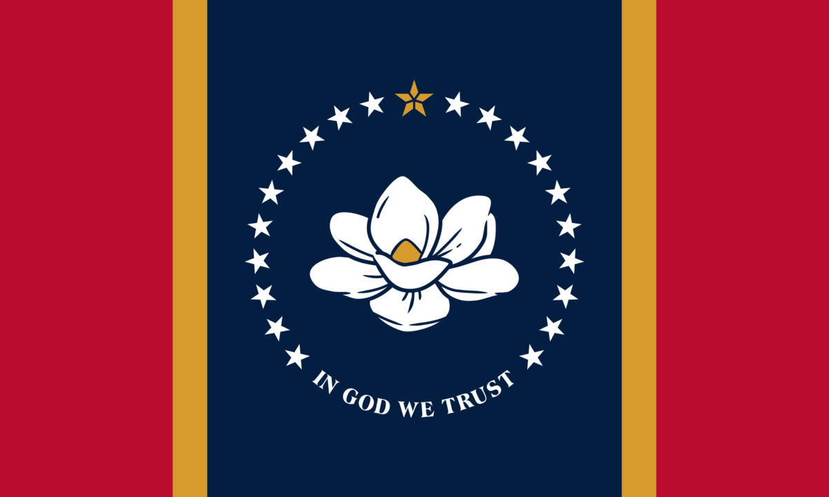 the flag of Mississippi with two red vertical bands, two gold bands and a blue field in the middle with a magnolia flower surrounded by stars. the text reads in god we trust. 