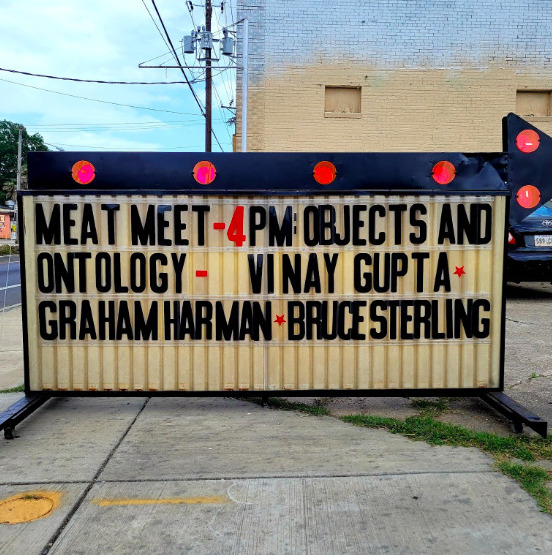 Old school, roadside sign for a Meat Meet salon event featuring philosopher Graham Harman, Mattereum founder Vinay Gupta and cyberpunk speculative fiction author Bruce Sterling. 