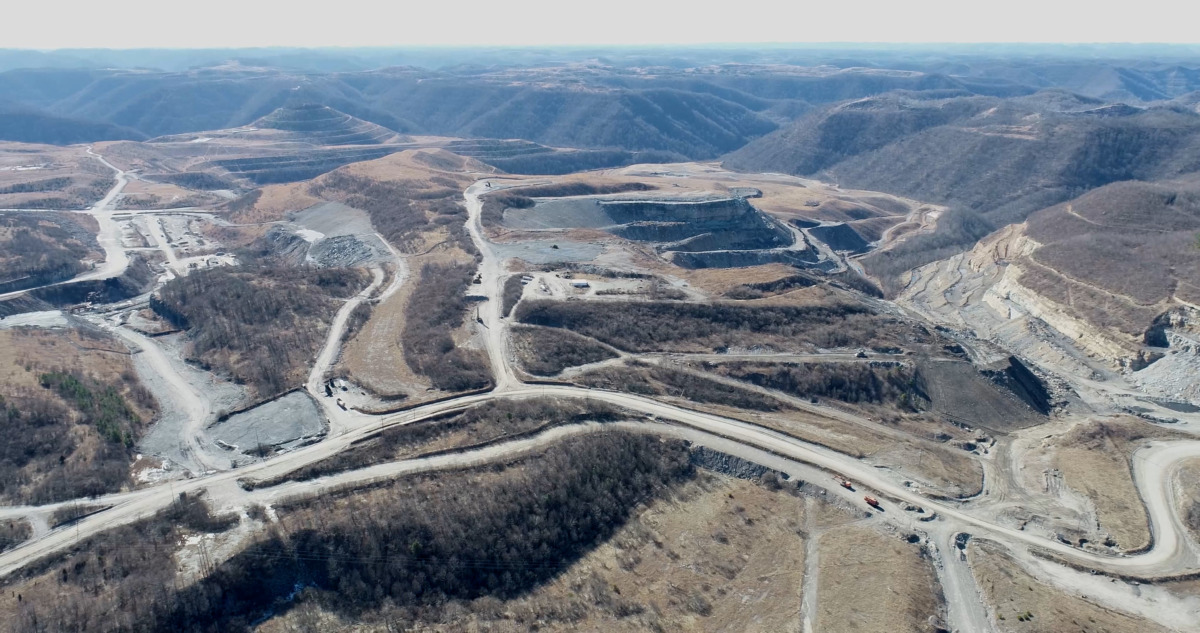aerial footage of destroyed mountains open for strip mining.