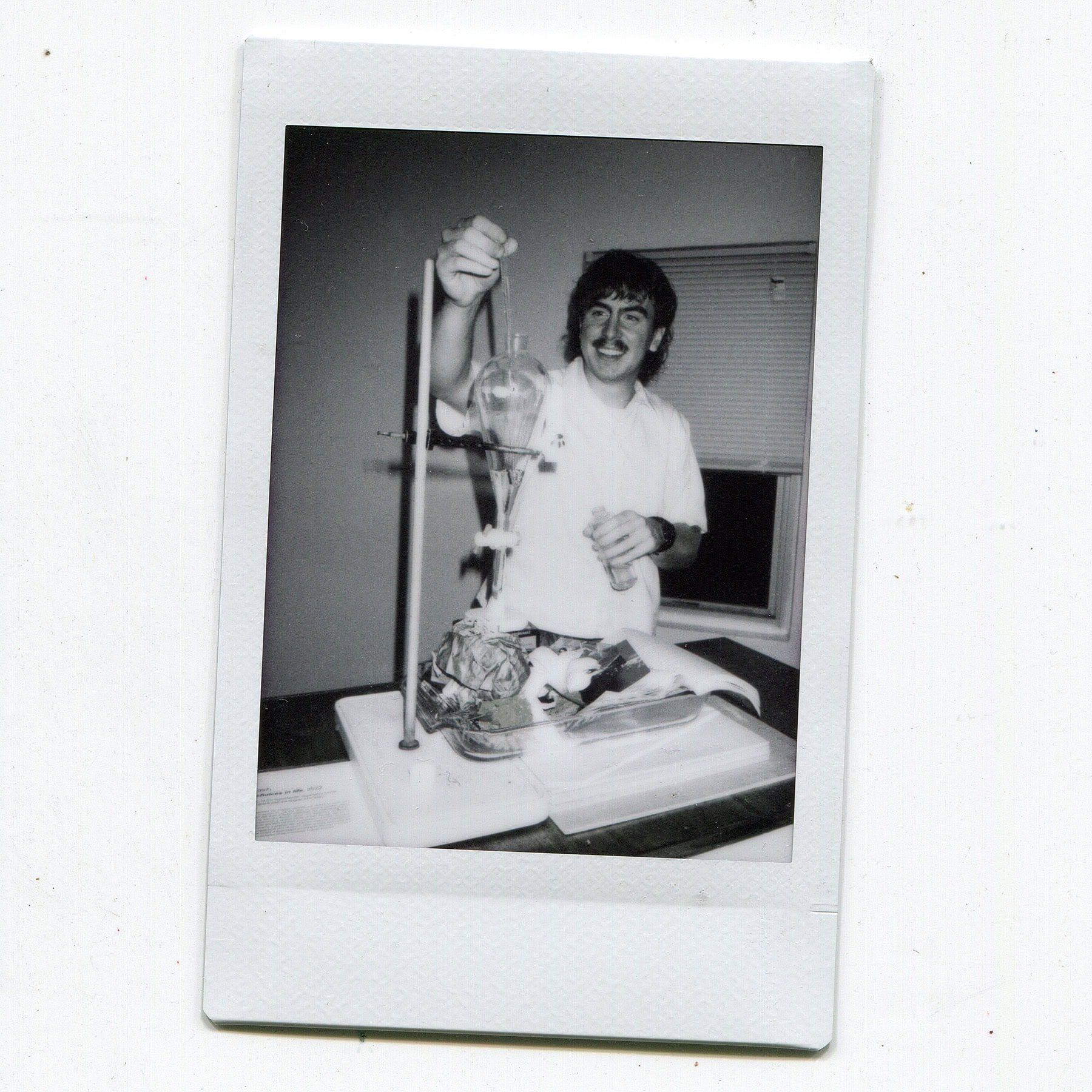 black and white polaroid of man